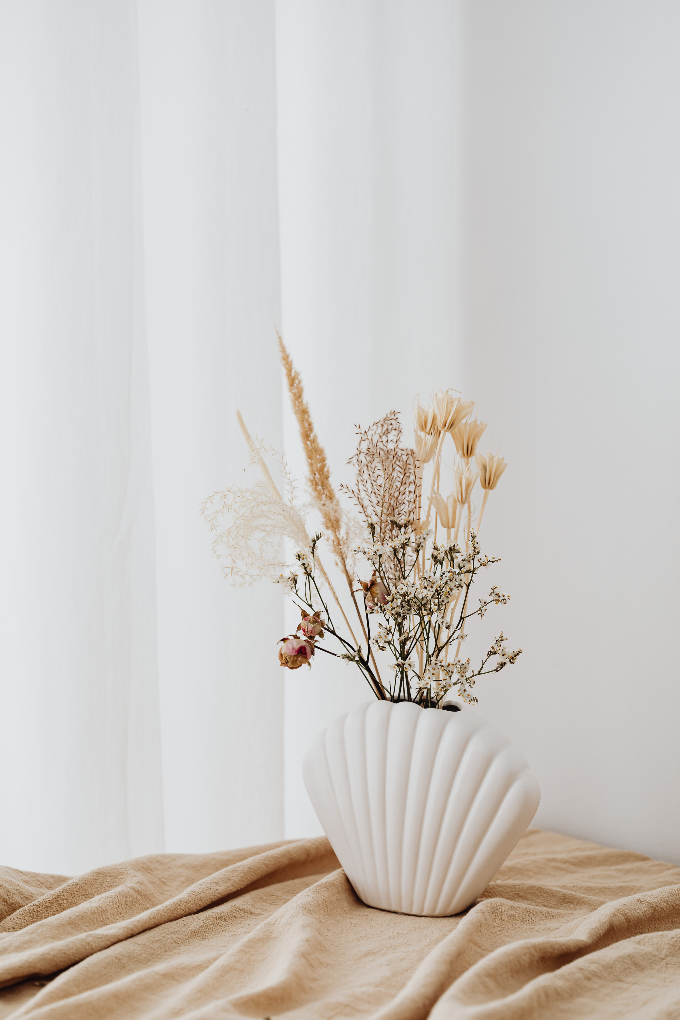 Dried Flowers on White Ceramic Vase